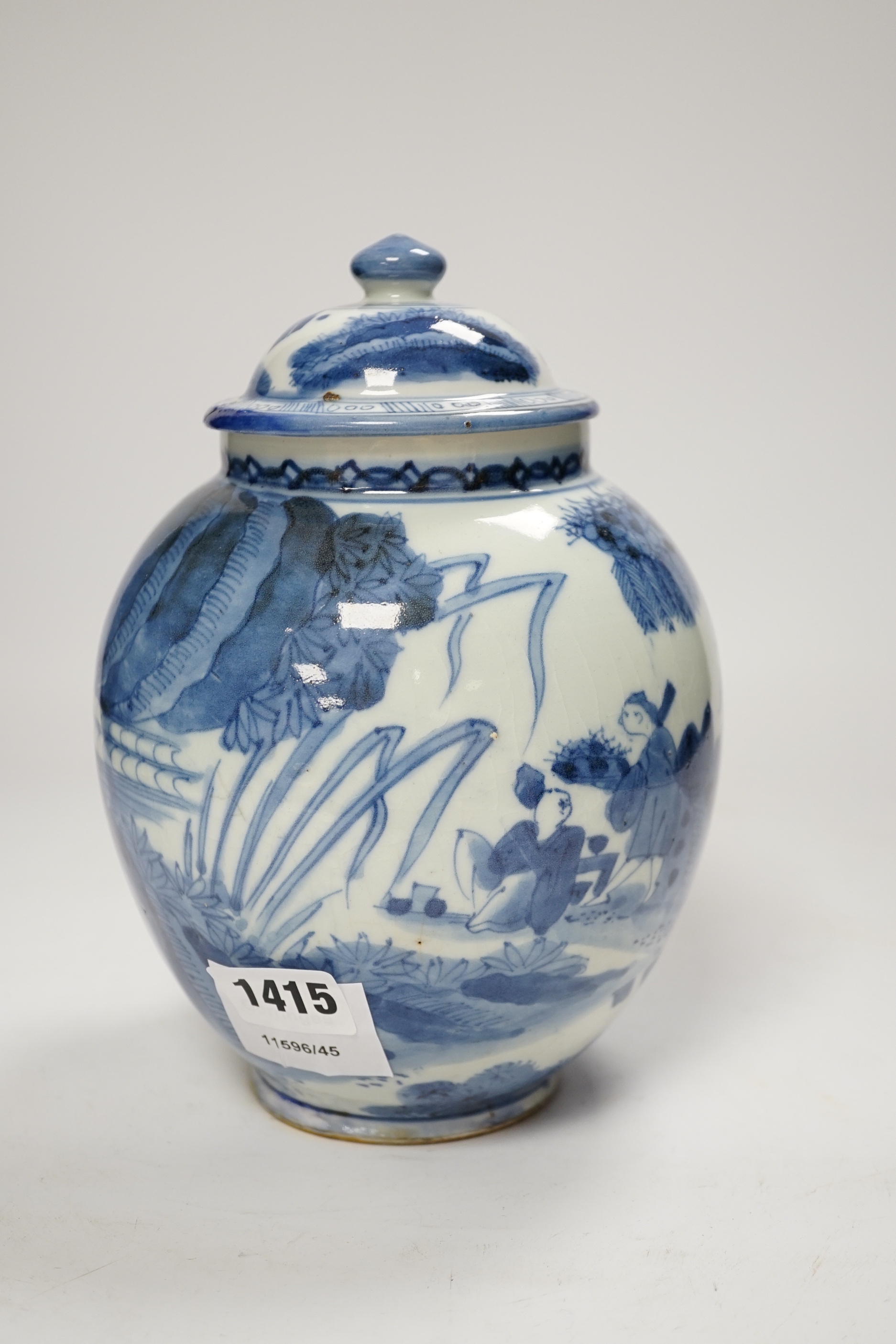 A 17th century Japanese Arita blue and white jar and cover, 22cm